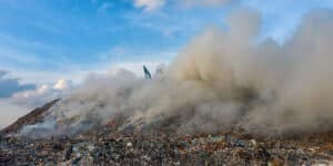 Photo: landfill burning. Pangolin Associates provides carbon management and sustainability services.